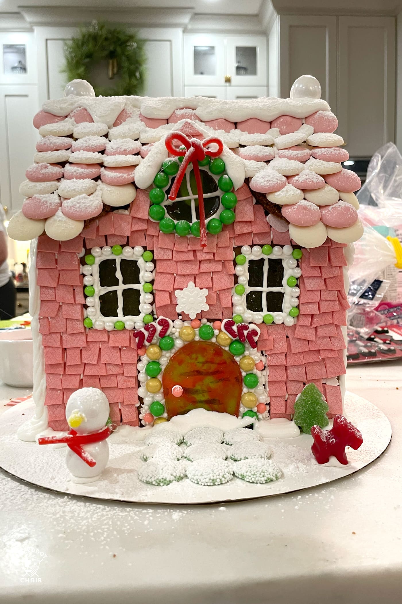 colorful gingerbread house on kitchen counter