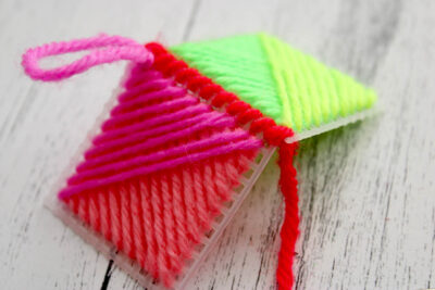 colorful yarn and plastic canvas ornament construction steps