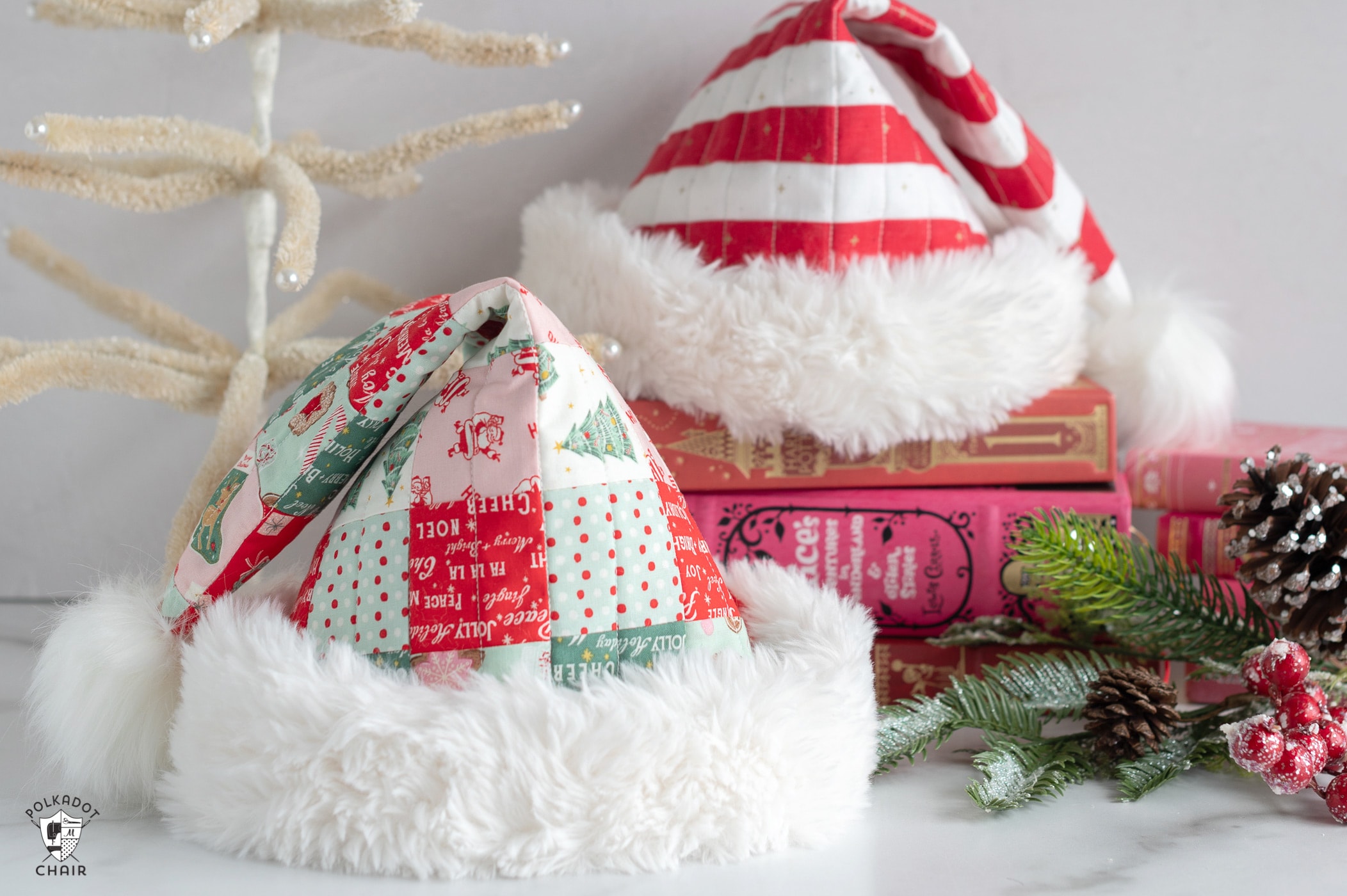 quilted santa claus hats on white table with christmas decor