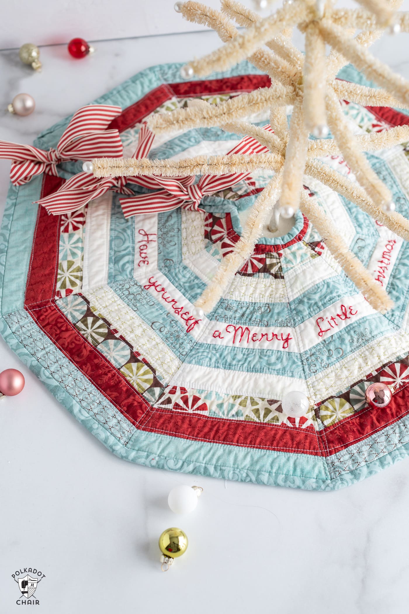 striped mini tree skirt on white marble table with ornaments