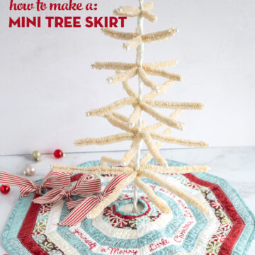 striped mini tree skirt on white marble table with white feather tree