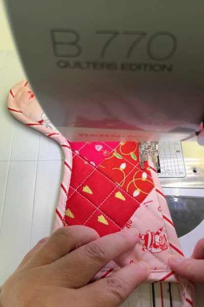 colorful stocking under foot of sewing machine