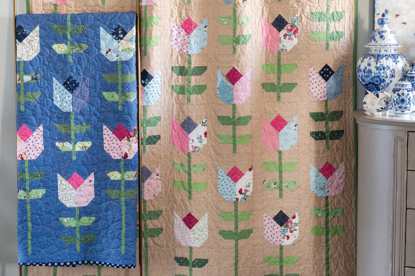 tulip quilts hanging on wall