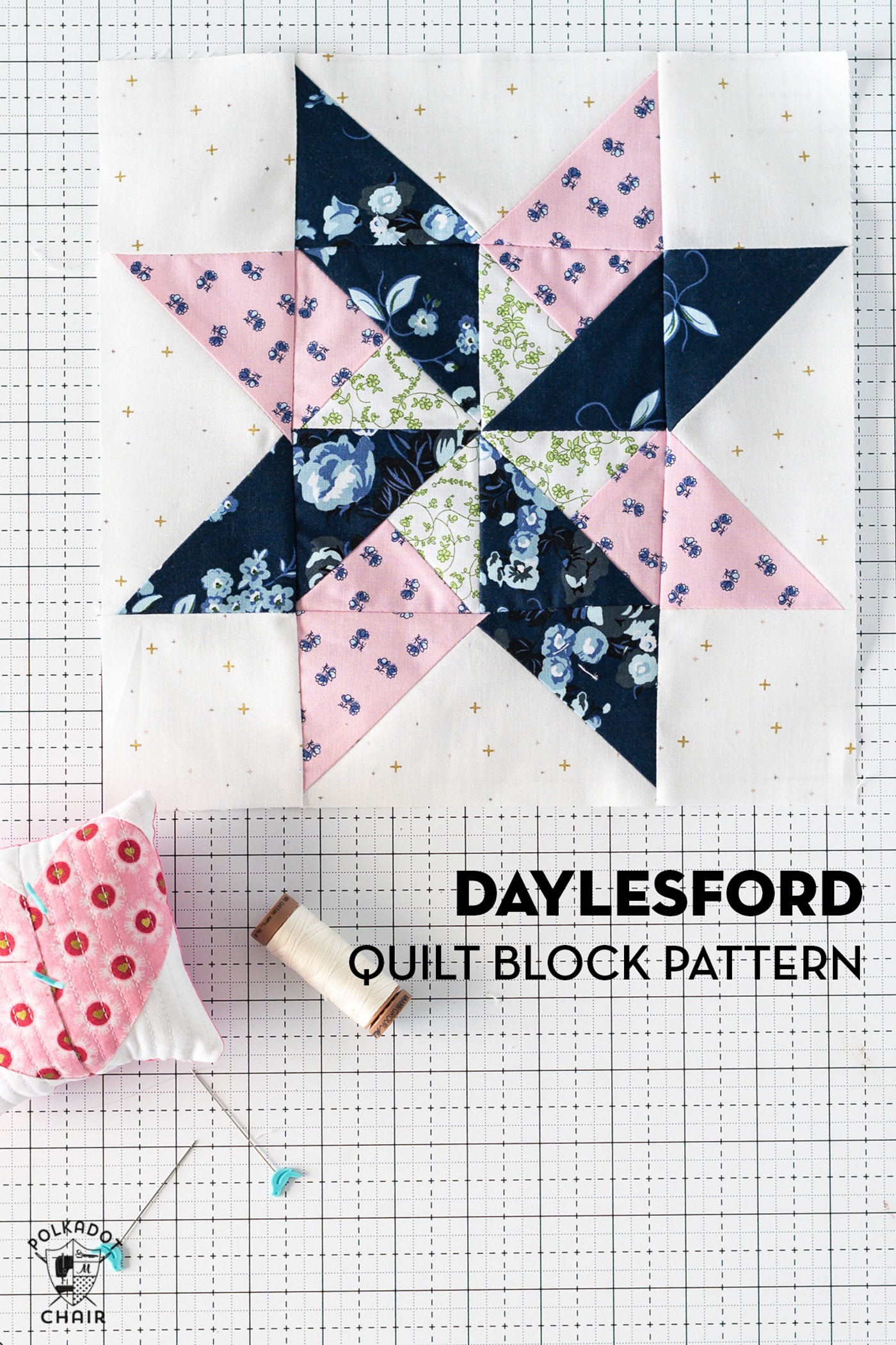blue and pink quilt block on white cutting mat