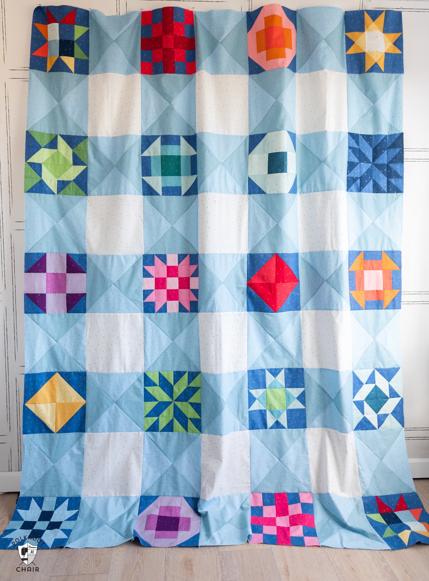 colorful geometric quilt on wall