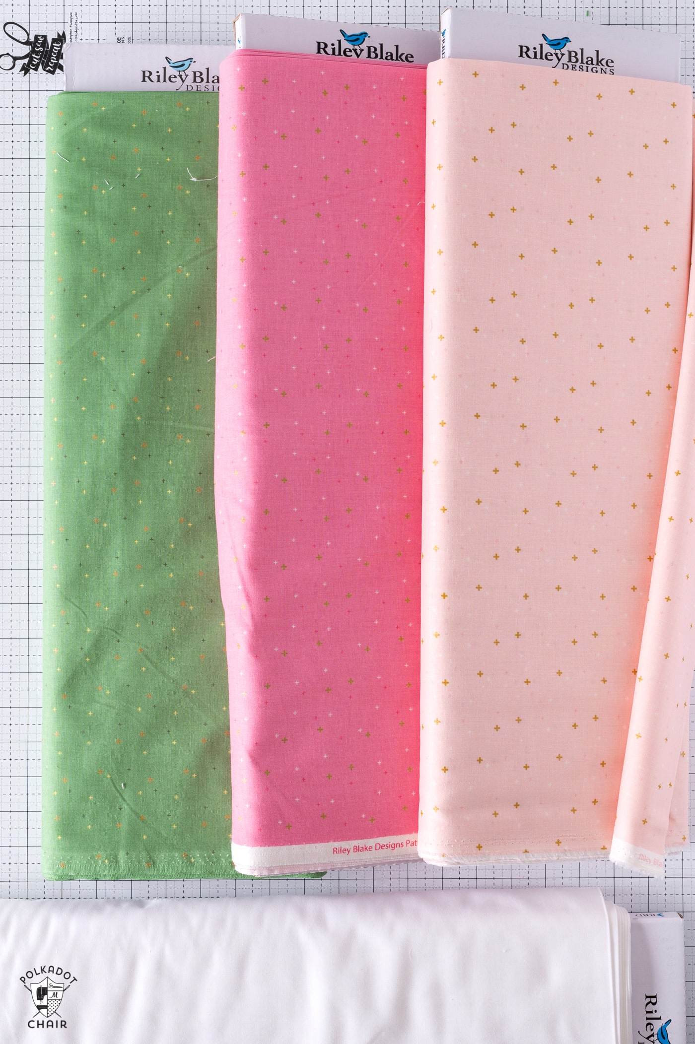 pink and green fabric bolts