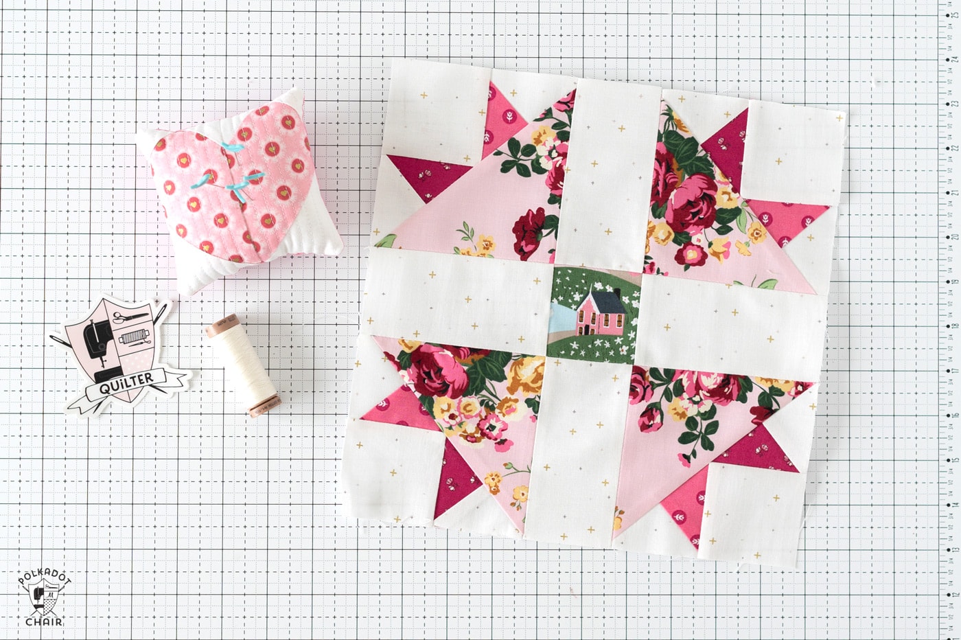 pink quilt block on cutting table