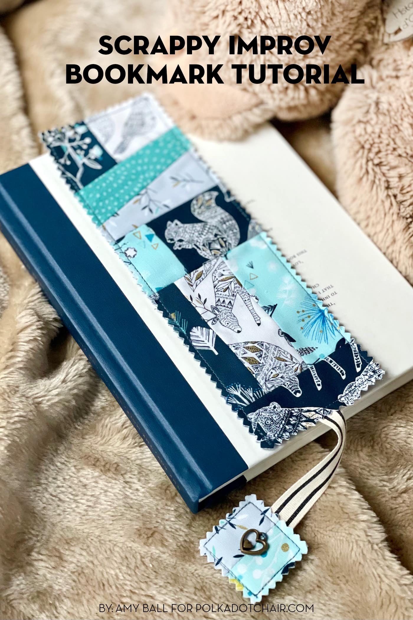 Blue patchwork bookmark on book on tan blanket