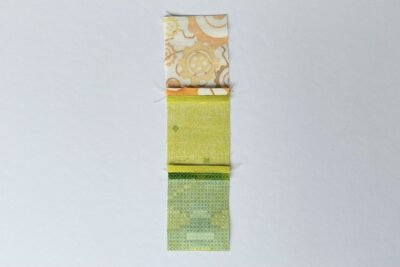 yellow and green fabrics on white table