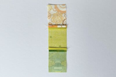 yellow and green fabrics on white table