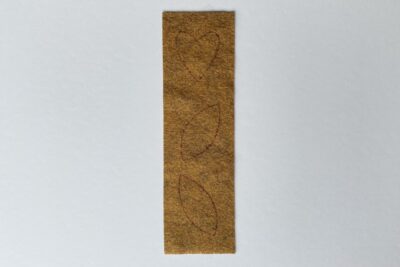 brown felt with drawn shapes