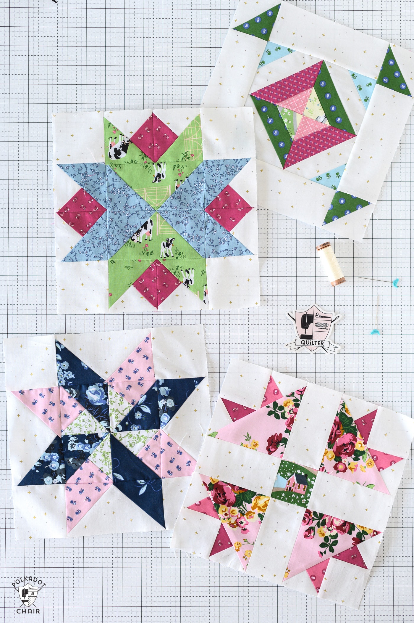 multiple blue, red and green star quilt blocks on white cutting mat