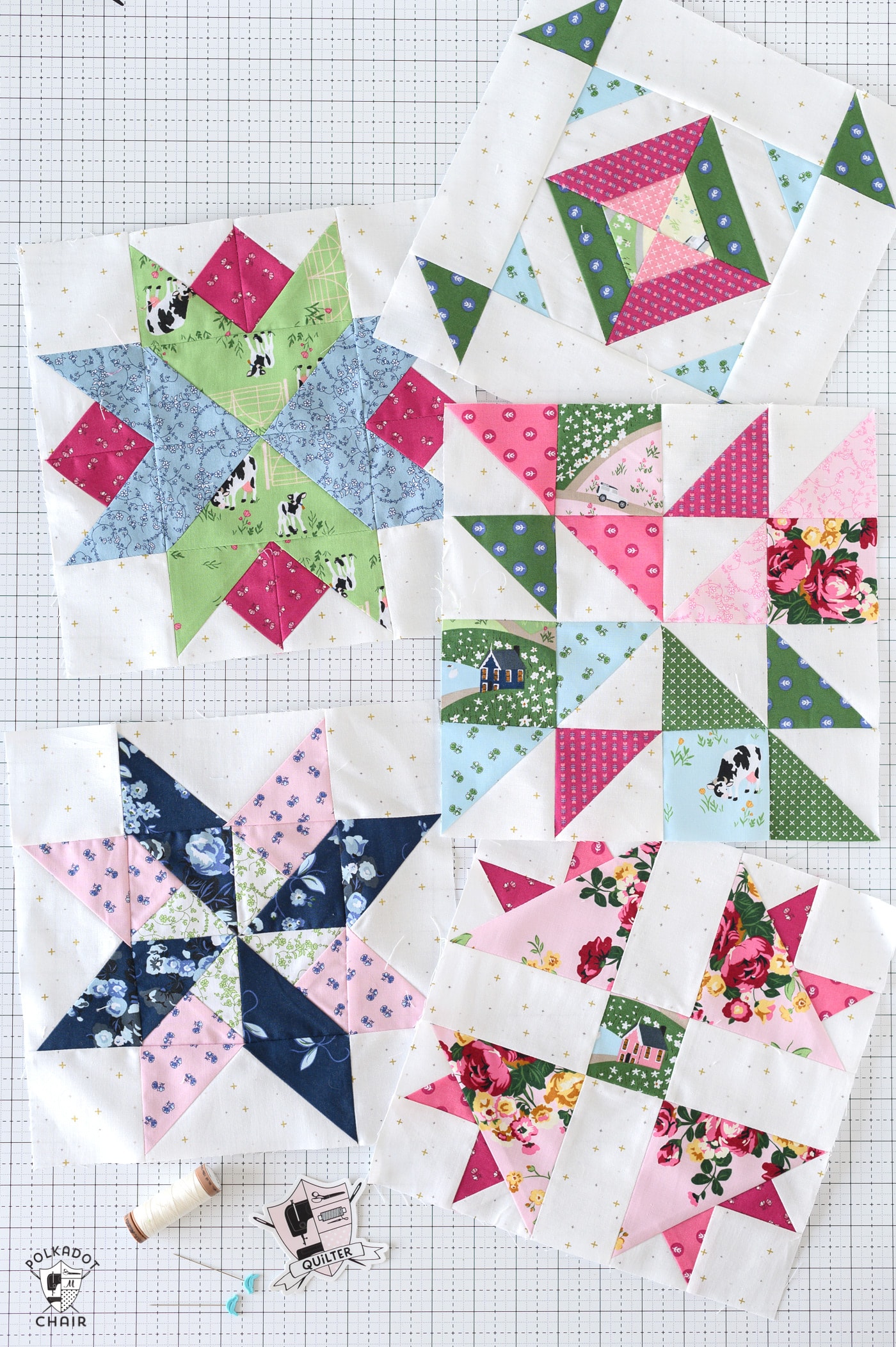five pink, blue and green colorful quilt blocks on white cutting mat