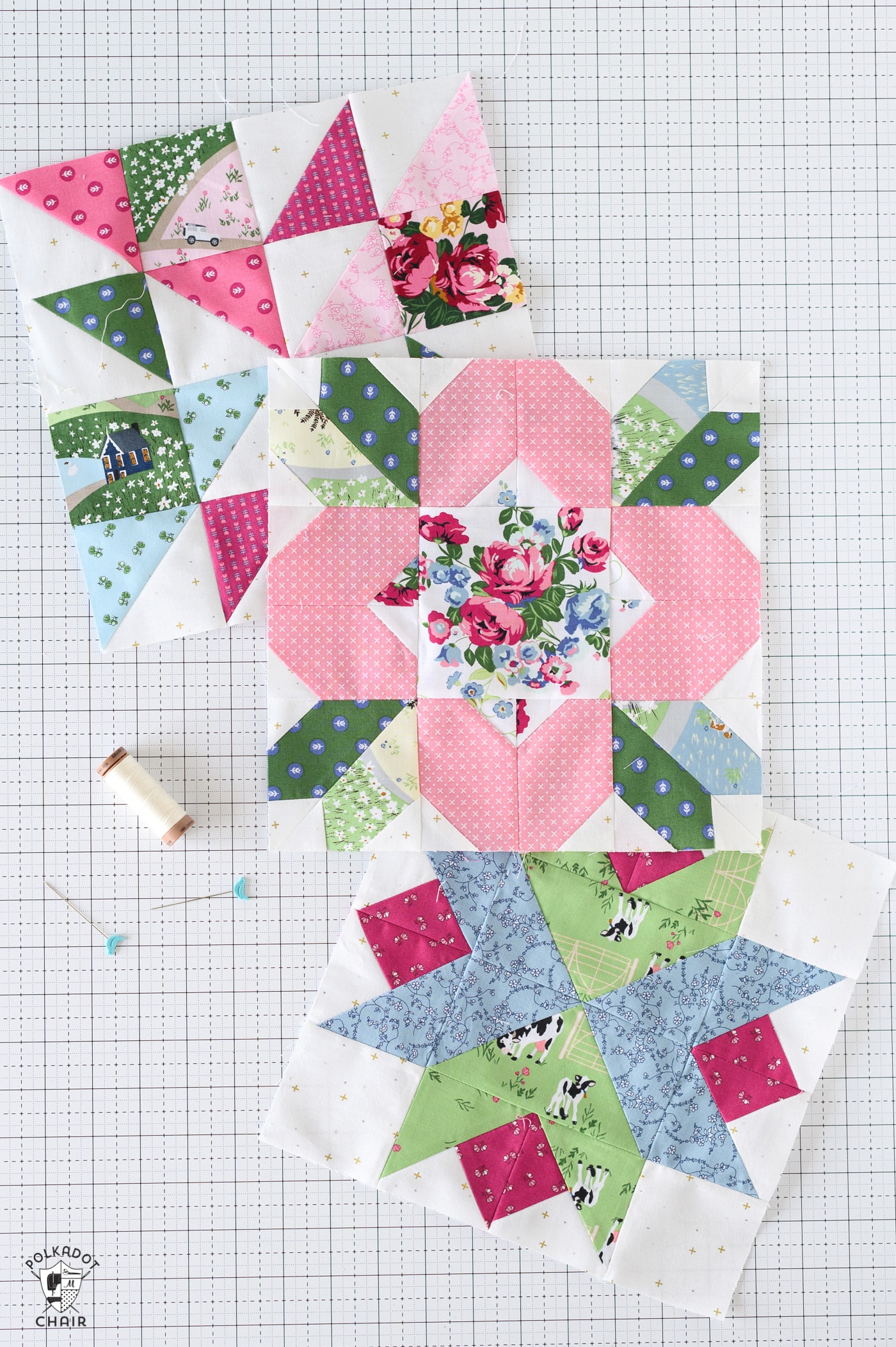 pink and green floral quilt block on white cutting mat