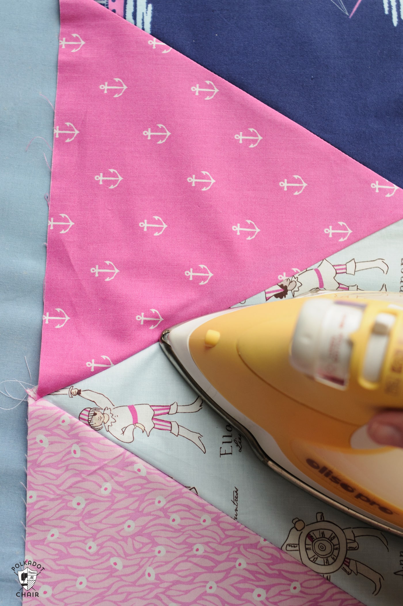 iron ironing pink and blue fabric
