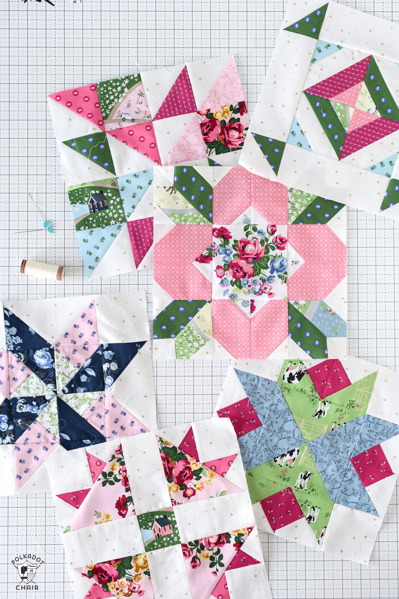 multiple pink and green floral quilt block on white cutting mat
