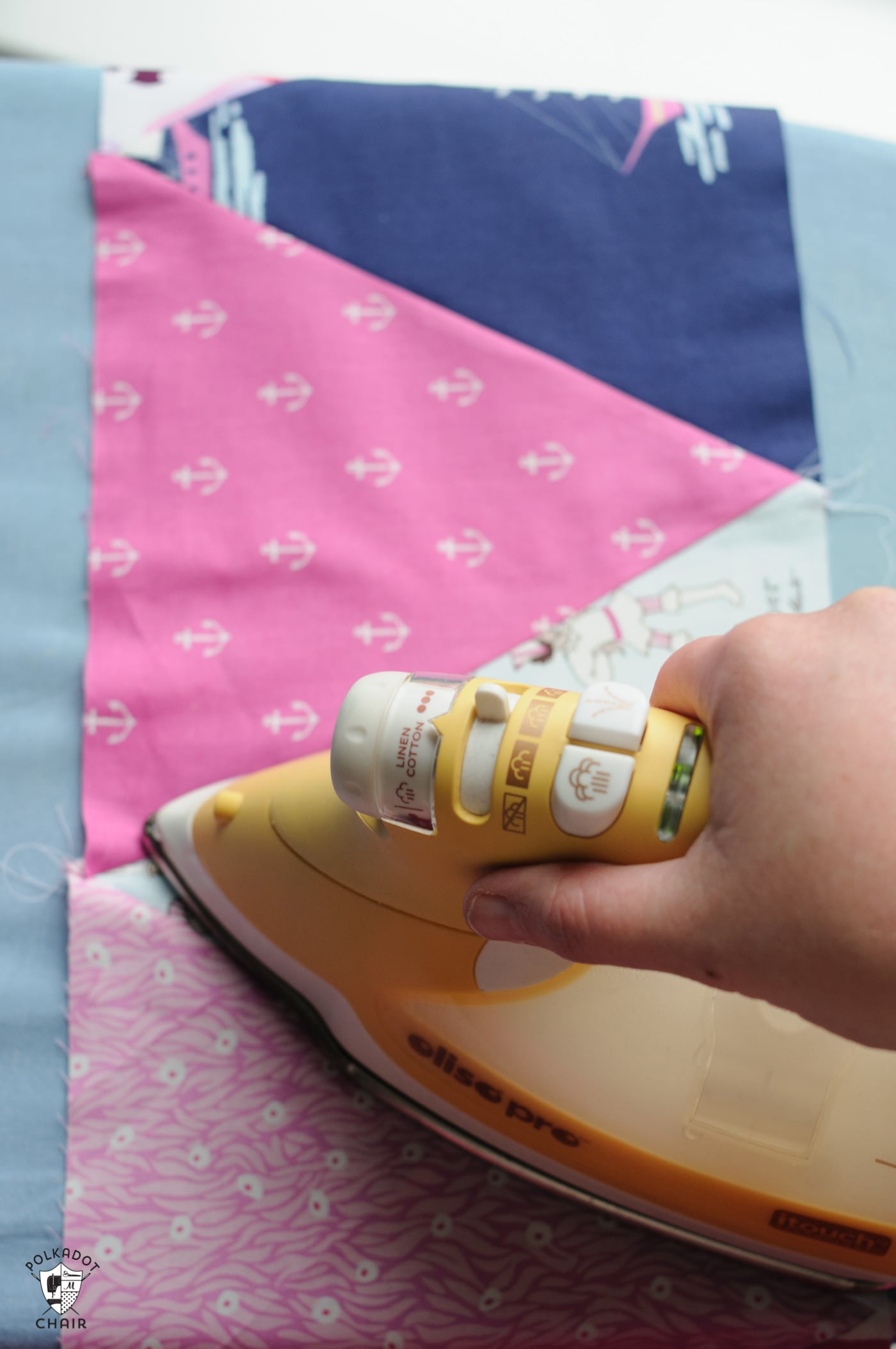 iron ironing pink and blue fabric