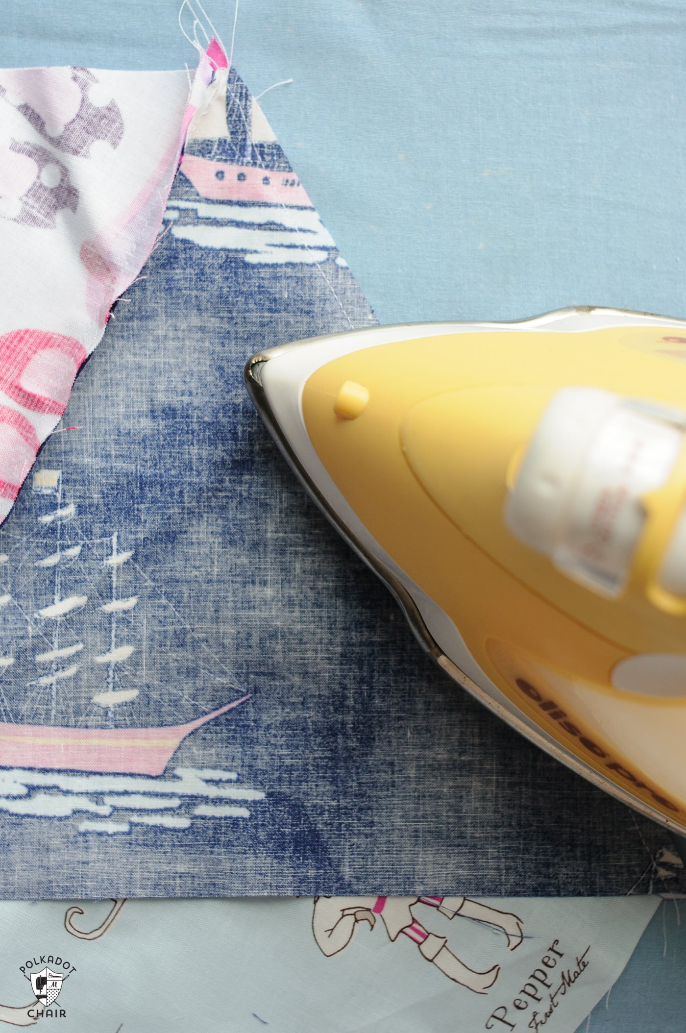 iron ironing pink and blue fabric