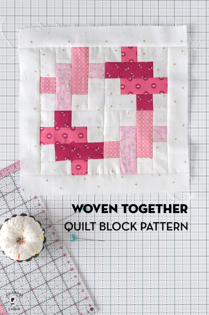 pink and white quilt block on white cutting mat with ruler