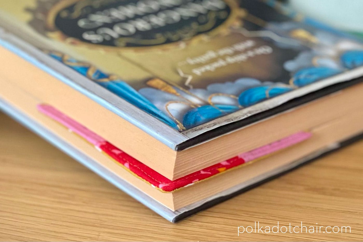 pink and red corner bookmark on corner of book page