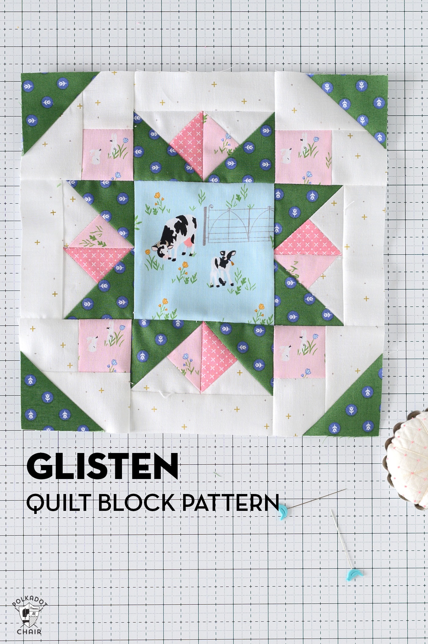 green star quilt block with pink accents on white cutting mat