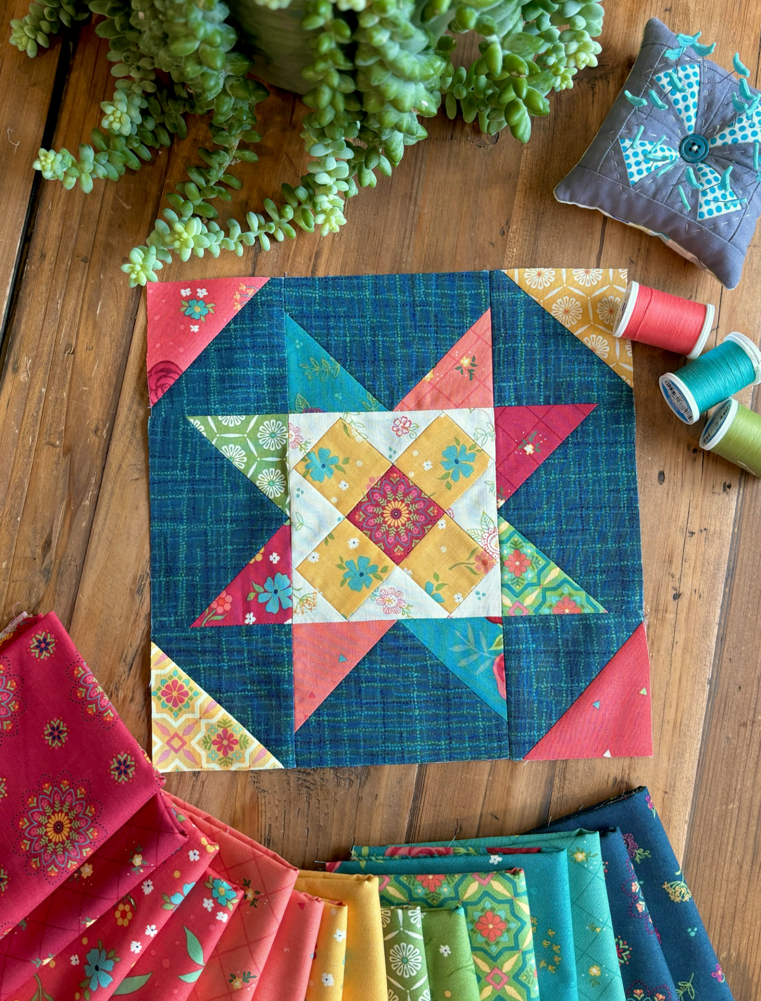 red and blue quilt block on wood table