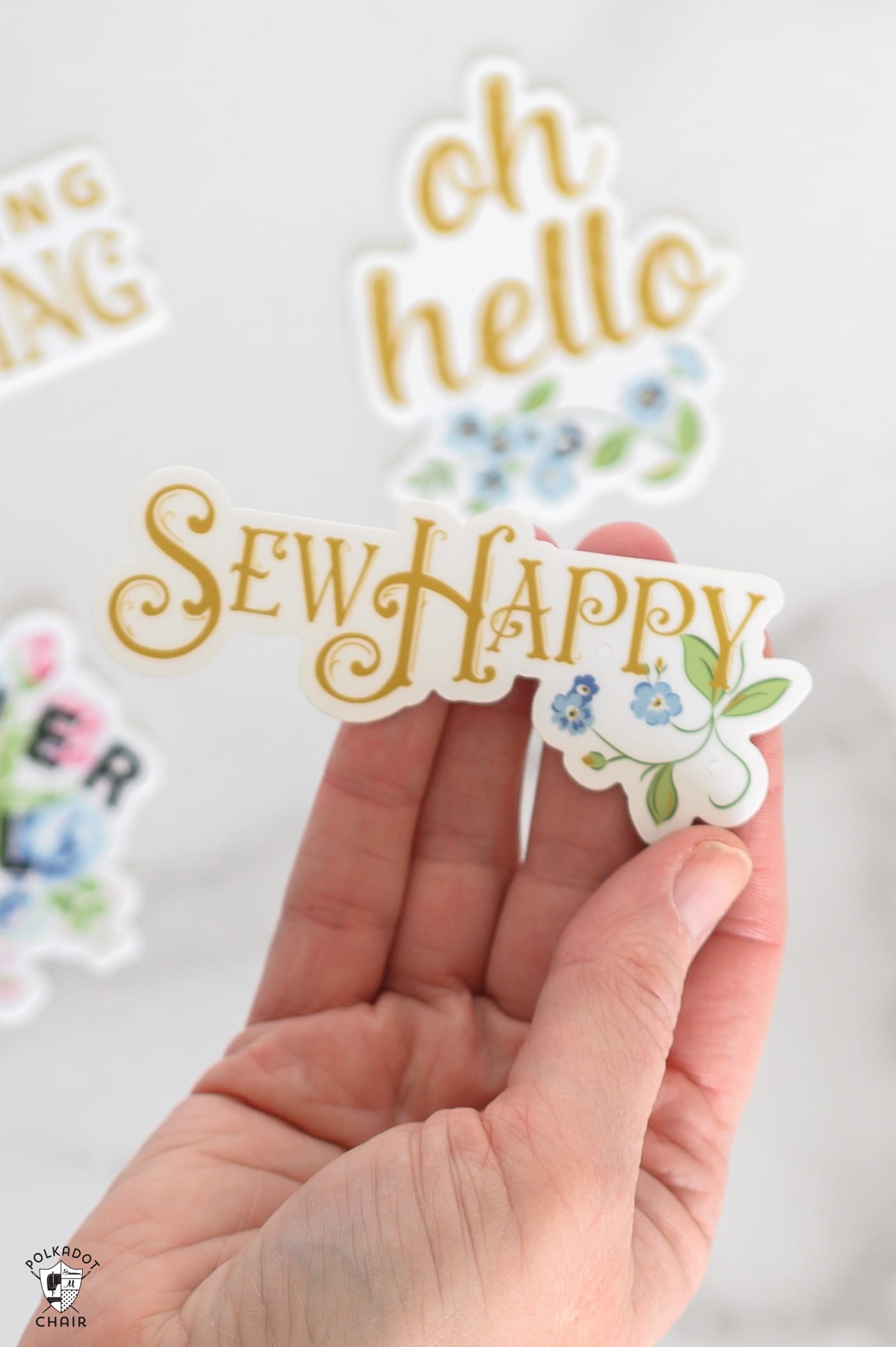 hand holding sticker