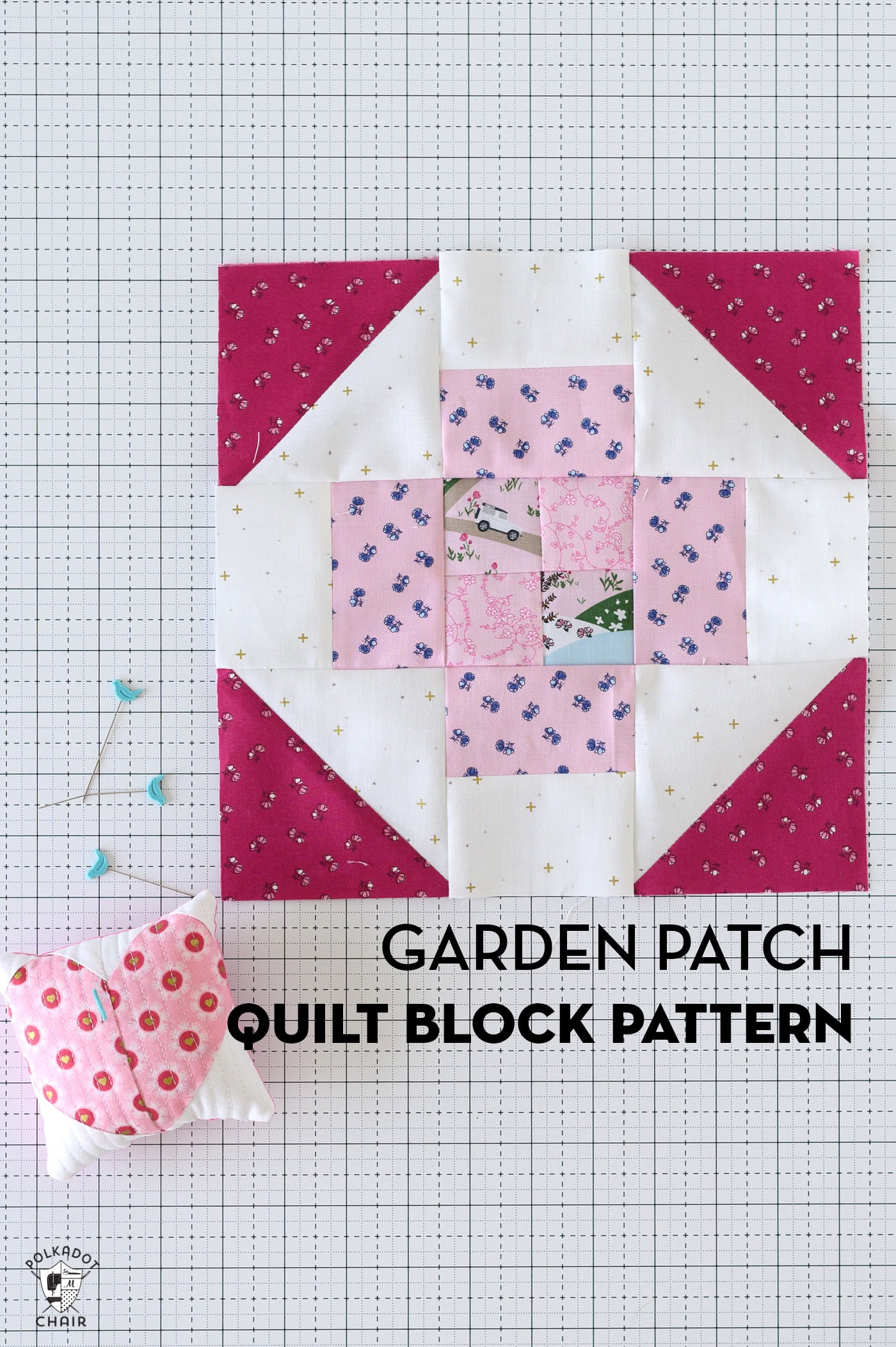 pink and red quilt block on white cutting mat with sewing notions