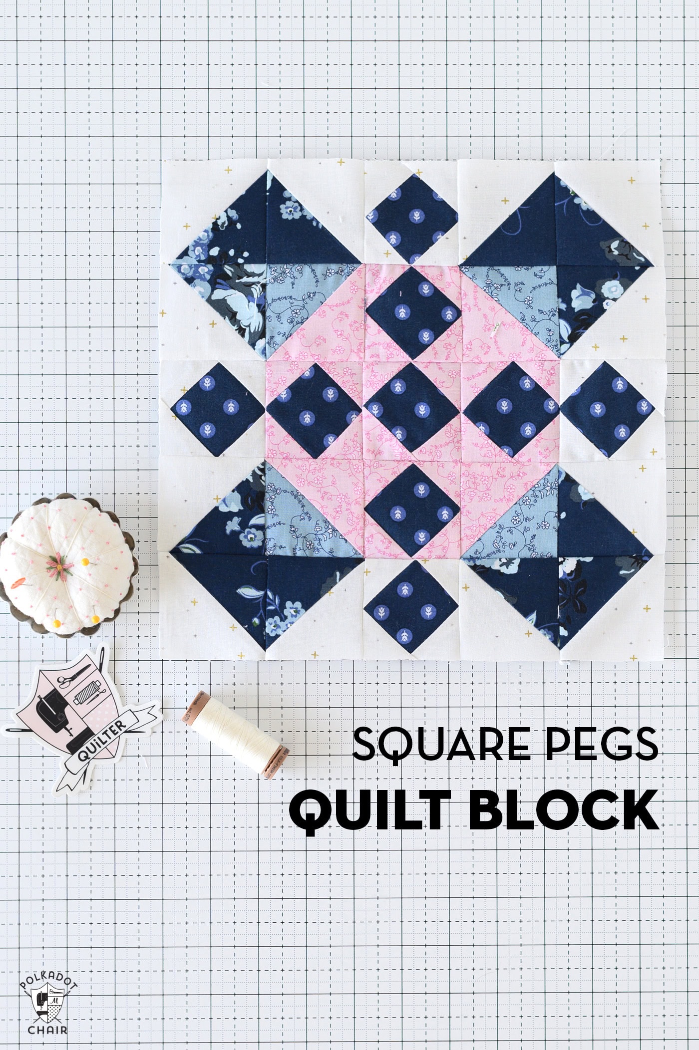 Blue and pink quilt block on white cutting mat