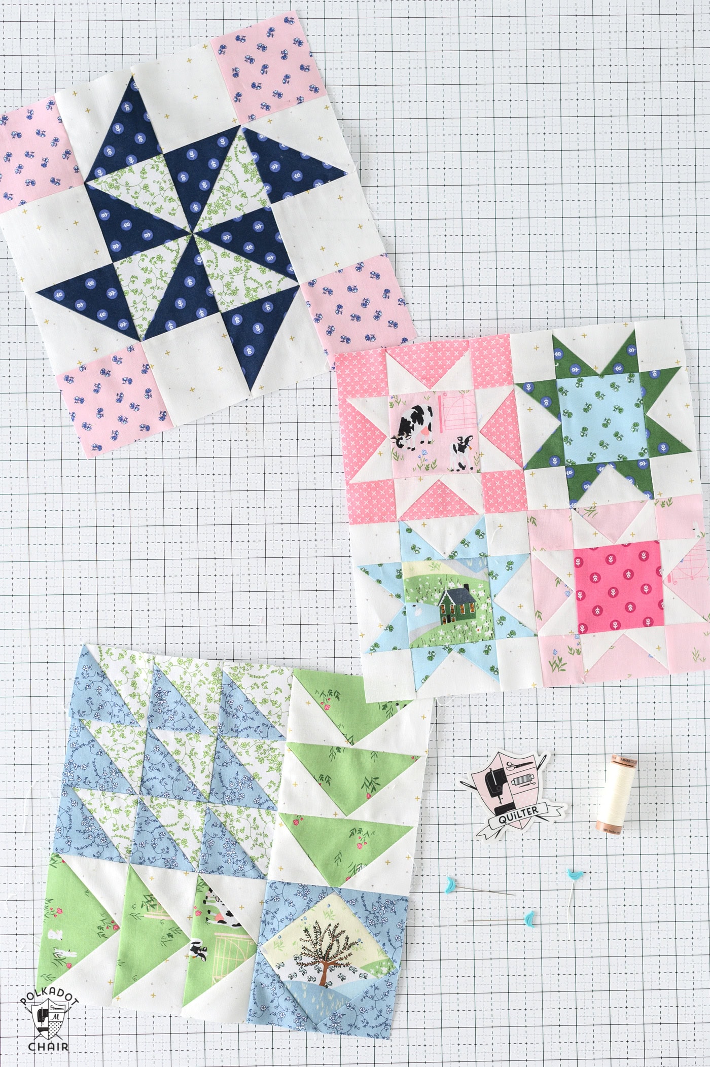 several Blue and green geometric quilt block on white cutting mat