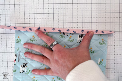 pink bag during construction process on white cutting mat
