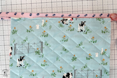 blue and pink bag during construction process on white cutting mat