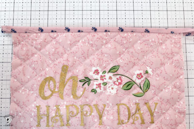 pink bag during construction process on white cutting mat
