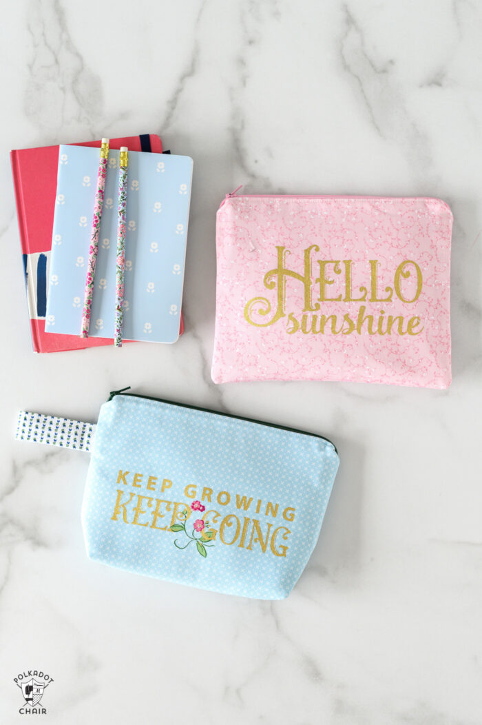 pink and blue zip pouches on white table