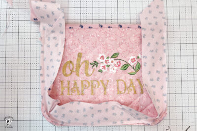 pink bag during construction process on white cutting mat with zipper