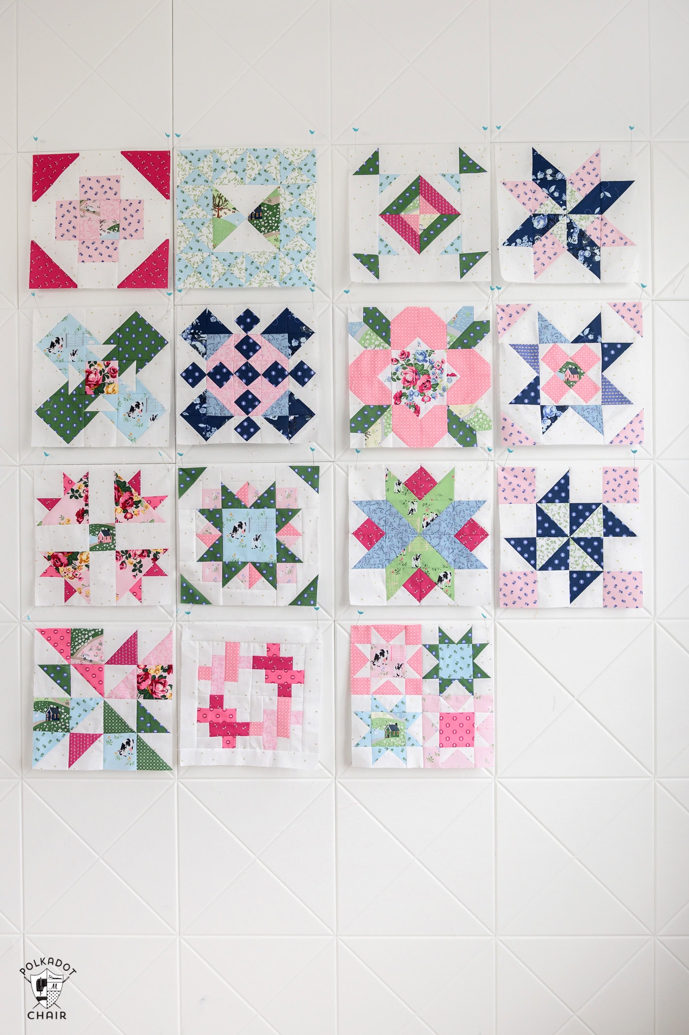 multiple quilt blocks on white pinboard