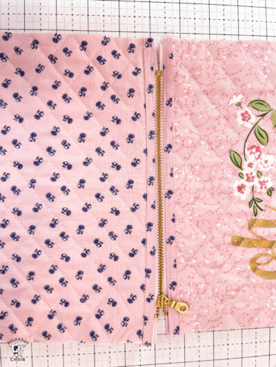 pink bag during construction process on white cutting mat with zipper