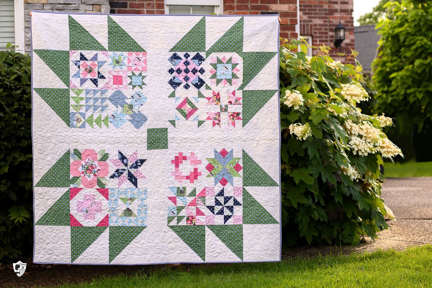 pink, green and blue quilt outdoors