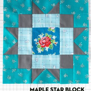 Aqua, blue and gray quilt block on white cutting mat
