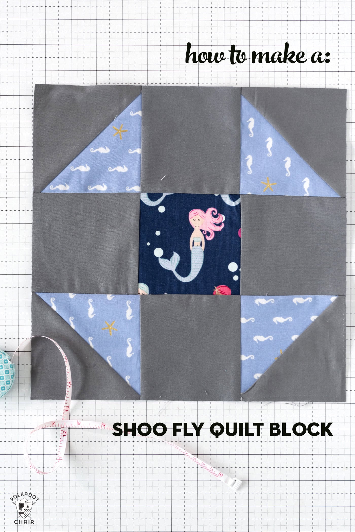 blue and gray quilt block on white cutting mat