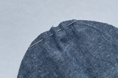 close up of needle in fabric
