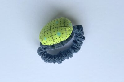 blue and green pincushion during construction steps