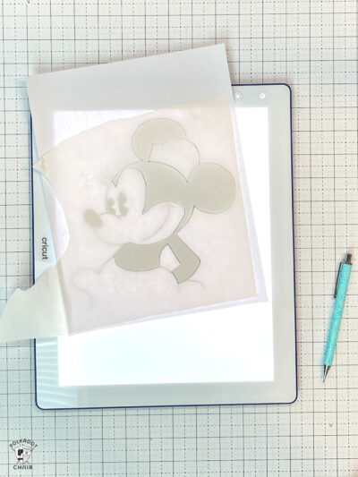 light box and paper and pencil on white cutting mat