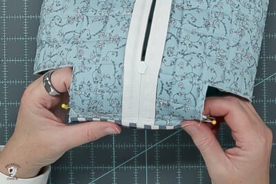 blue ruffle zip pouch in progress, pouch on blue cutting mat
