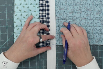 blue ruffle zip pouch in progress, pouch on blue cutting mat
