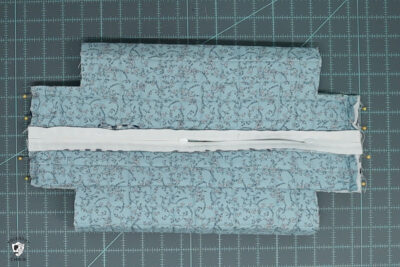 blue ruffle zip pouch in progress, pouch on blue cutting mat