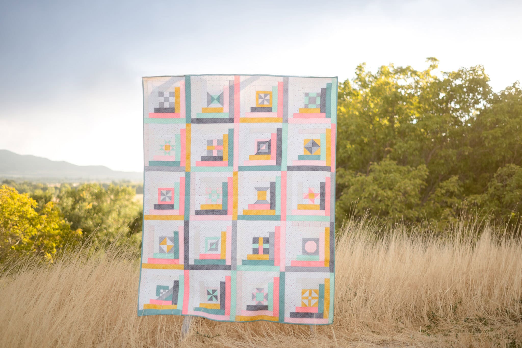 log cabin quilt in field outdoors
