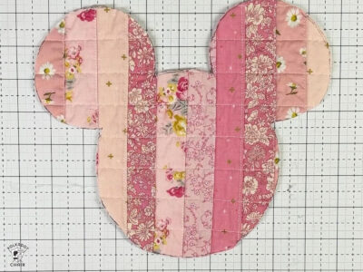 cut out Mickey head shape from pink quilted fabric
