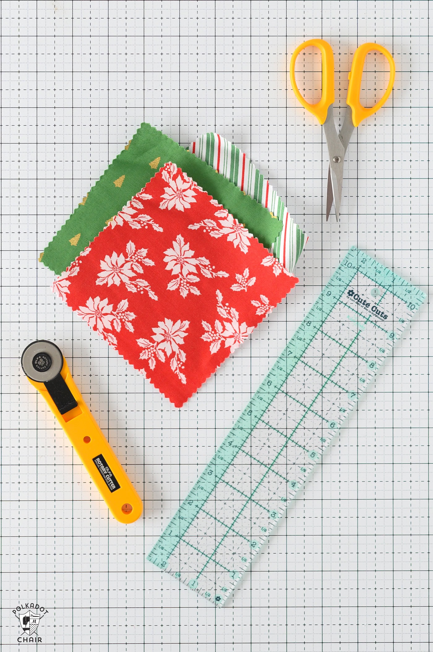 fabric and cutting tools on white table