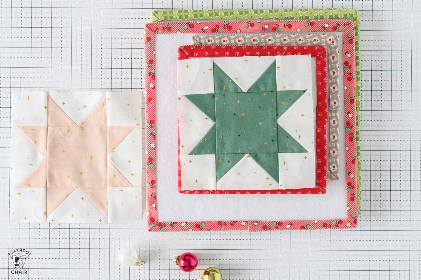 stack of design boards with quilt block on top